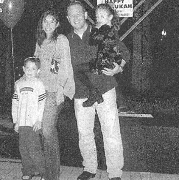 Brett, Maisa, Max and Victoria Kingstone light the menorah at the Dr. Phillips Marketplace Chanukah celebration last year. The family is sponsoring the menorah lighting again this year.